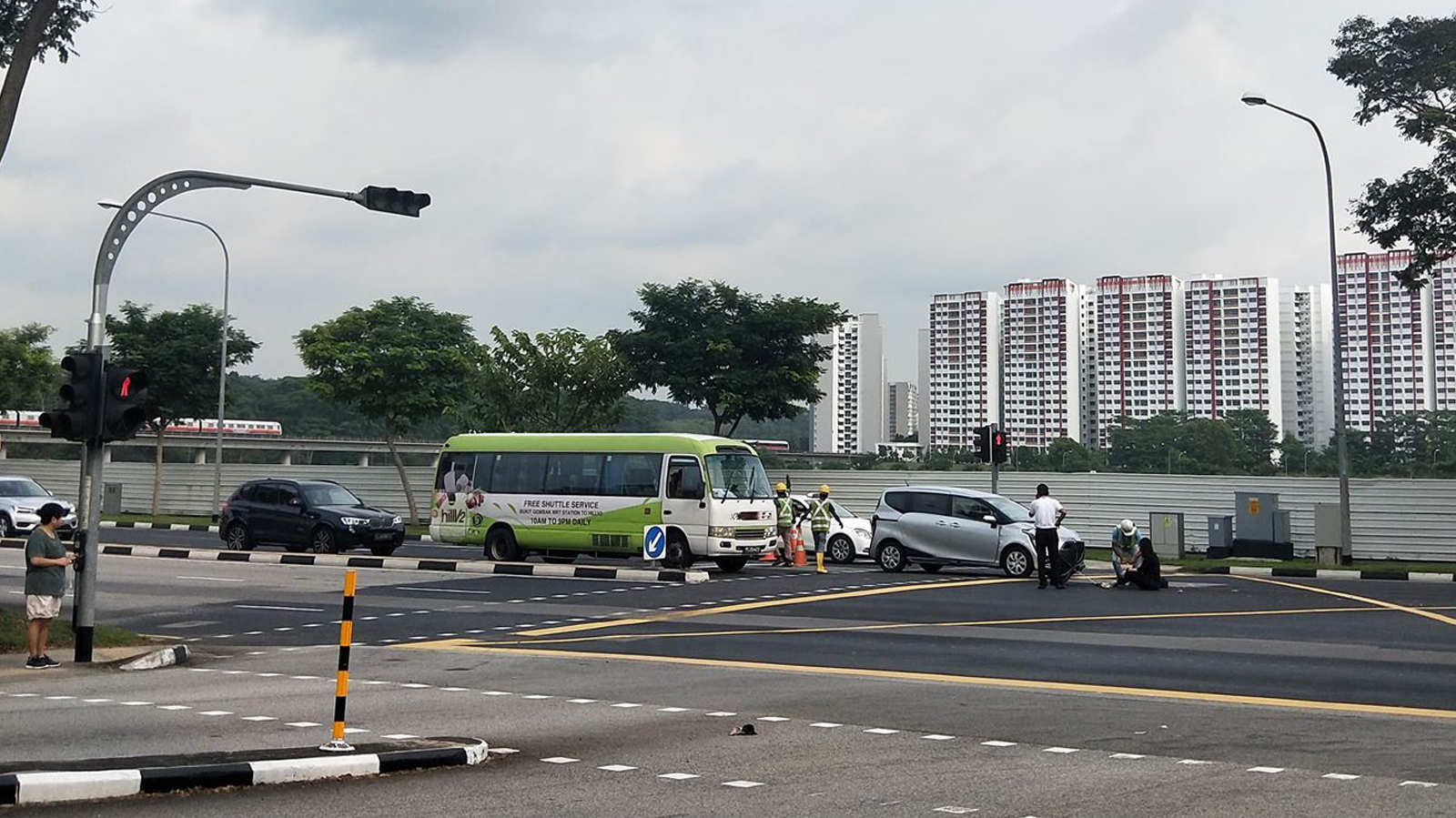 Migrant workers form human shield to protect injured pedestrian