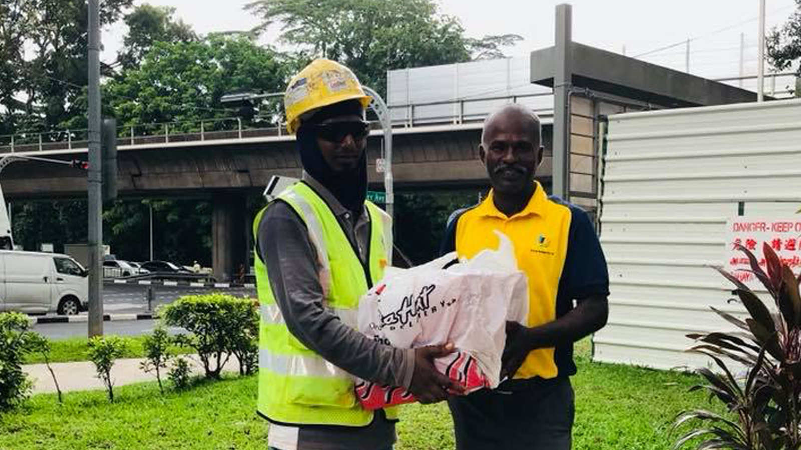 Surprise delivery of pizzas and doughnuts for migrant workers on Deepavali