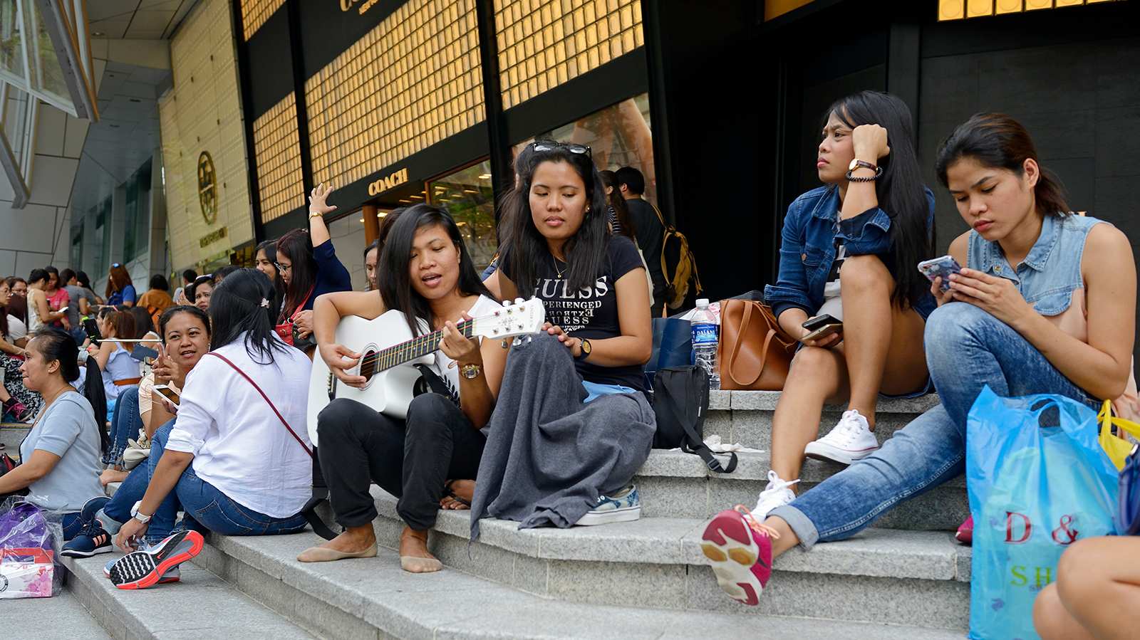 Why do foreign workers here picnic by the roadside?