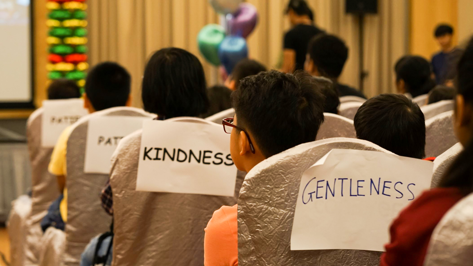 Children listening attentively at Life Community Services Society