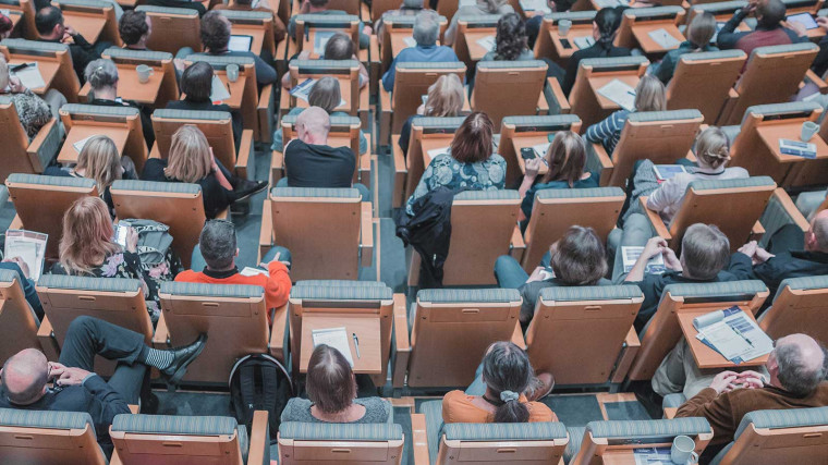 Top down view of university studnets attending a lecture.