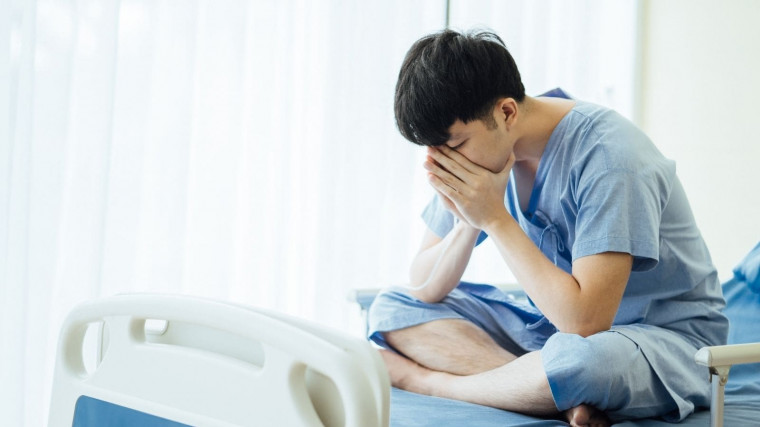 25-year old sad asian man who is a patient